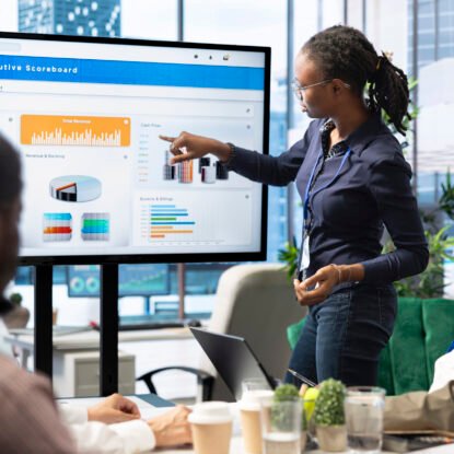 Advisory board members and team leaders gathering to review project outcomes, discuss resource allocation to ensure objectives achievement. Diverse business associates in a meeting.